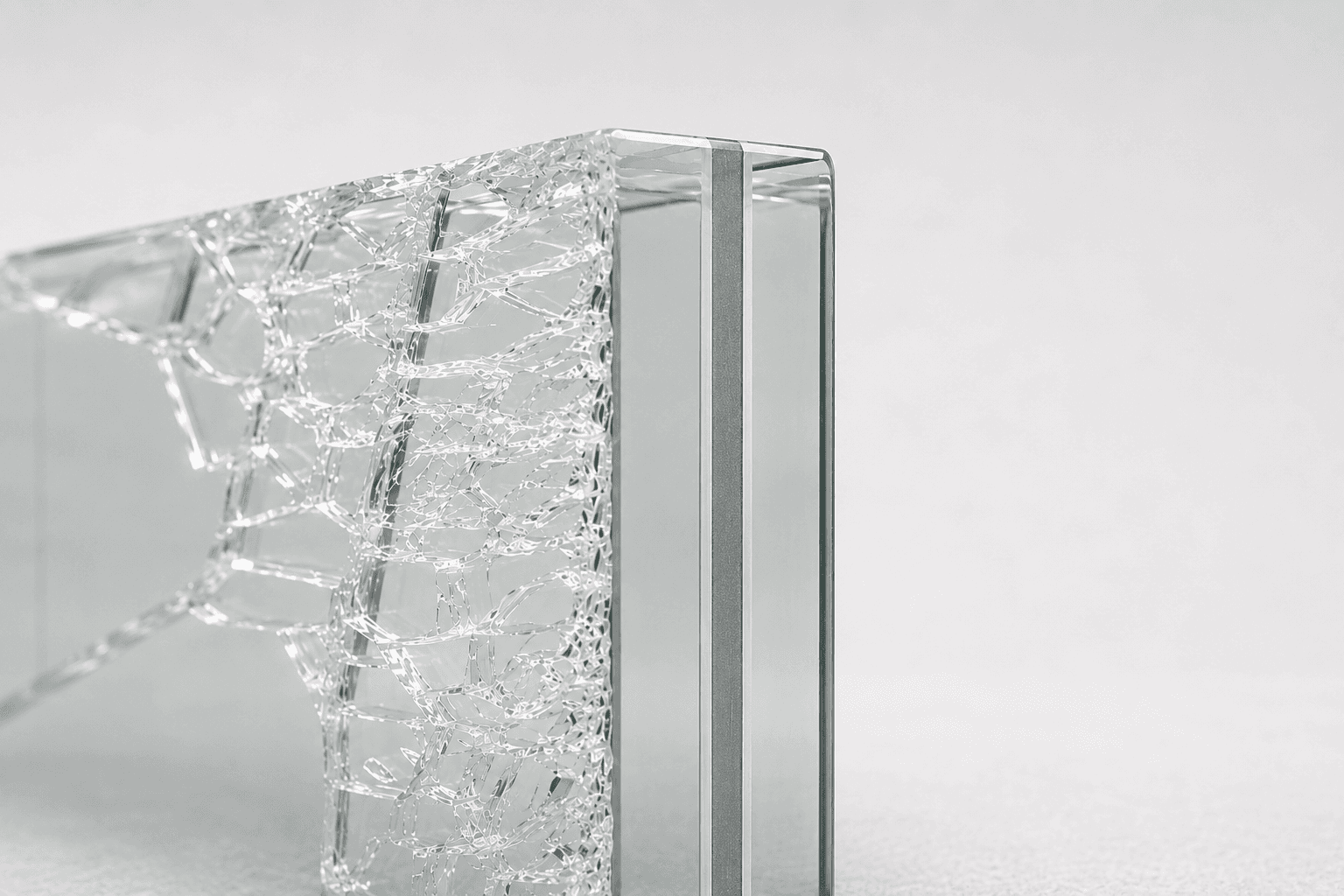 Laminated glass holding together after impact, interlayer visible